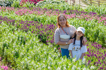 Mother and Daughter in Flower Field