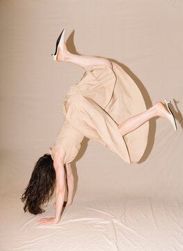 Dynamic Acrobat Dance In Beige Dress With Heels
