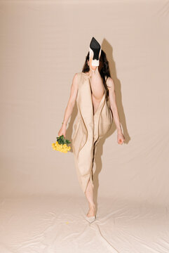Beige Dress Pose With Yellow Bouquet