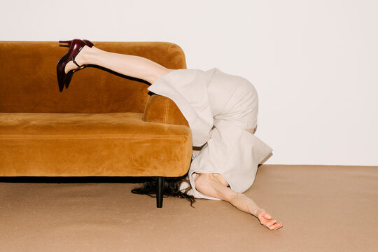 Playful Pose Over Sofa With Heels