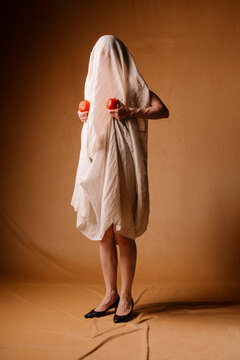 Ghostly Figure With Tomatoes Shrouded In White