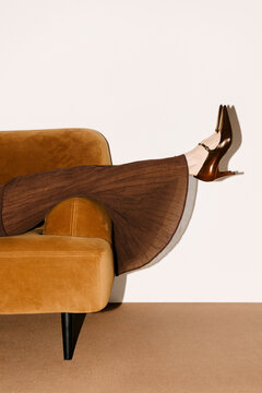 Elegant Brown Sofa Fashion Pose With Boots