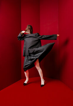 Dynamic Dance Move In Black Suit Red Studio