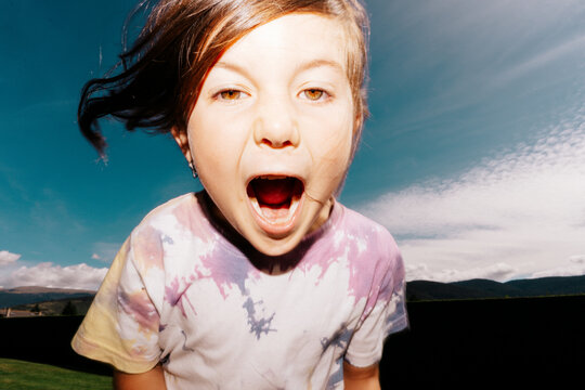 Kid screaming, scary face or excitement. UGC