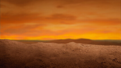 Dramatic low-angle view of a sandy desert mound under a fiery sunset sky with dark storm clouds and golden light. Ideal for cinematic backgrounds and conceptual themes © Leo Lintang