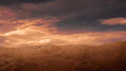 Dramatic low-angle view of a sandy desert mound under a fiery sunset sky with dark storm clouds and golden light. Ideal for cinematic backgrounds and conceptual themes © Leo Lintang