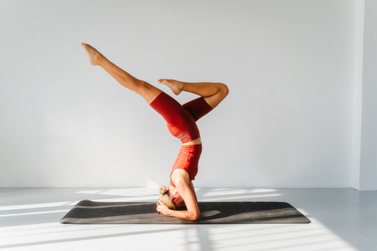 Woman doing a headstand in yoga