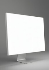 Fototapeta premium Modern computer monitor, blank white screen, thin bezel, sturdy stand, neutral gray background, soft lighting, subtle shadows, minimalist design, contemporary aesthetic.