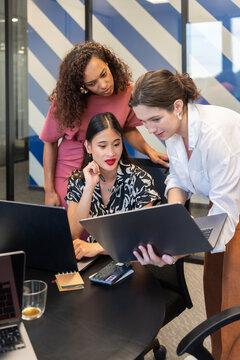 Women Collaborating in a Modern Office Space During a Meeting