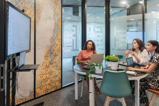 Team Meeting in a Modern Office Discussing Project Updates