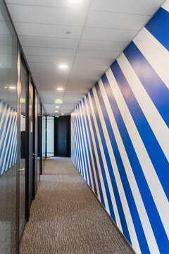 Modern Hallway With Blue and White Striped Wall Design in Office