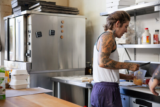 Focused chef preparing food in kitchen