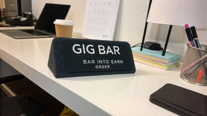 Fototapeta premium Modern workspace with gig bar sign promoting flexible work opportunities and encouraging productivity in a creative environment