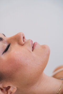 Woman's serene face relaxing during a beauty treatment