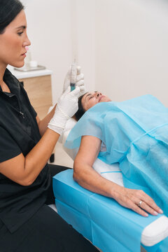 Aesthetic doctor performing cosmetic botox injection procedure