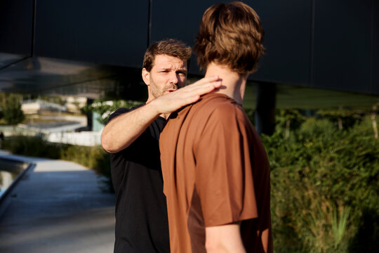 Trainer adjusting shoulder position during session