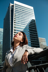 Fototapeta premium Businesswoman enjoying city sun during urban break