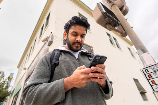 texting mobile phone street corner 