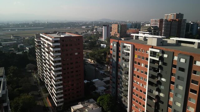 Aerial of zona 14 downtown Guatemala City with view of airport and plaza Argentina