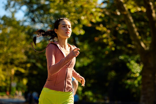 Pretty woman is running in the park