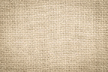 Jute hessian sackcloth woven hemp burlap gauze fibre fabric textile texture background in sepia cream old aged brown color