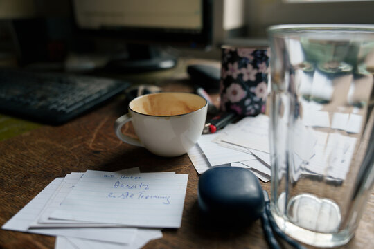 Cup and Notes on a Desk