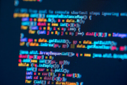 extreme close-up of programming languages -JavaScript . Multicolor of pixel on computer screen.