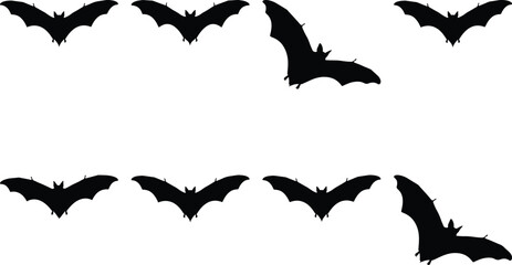 Fototapeta premium Flying silhouettes of bats in a dark night sky formation
