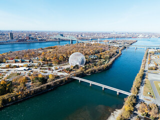 Obraz premium Aerial view of Montreal with Biosphere and autumn landscape over river islands. g.