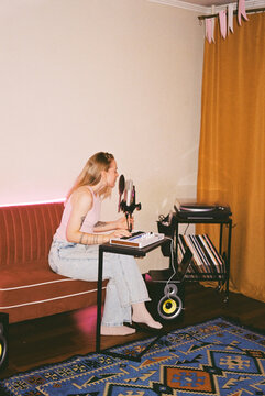 Home Music Rehearsal: Artist Recording on Sofa