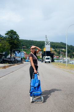 Person With Trolley in Urban Setting