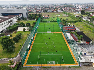 aerial shot of a mini soccer field in a densely populated area of ​​Yogyakarta © Nasrul Ma Arif