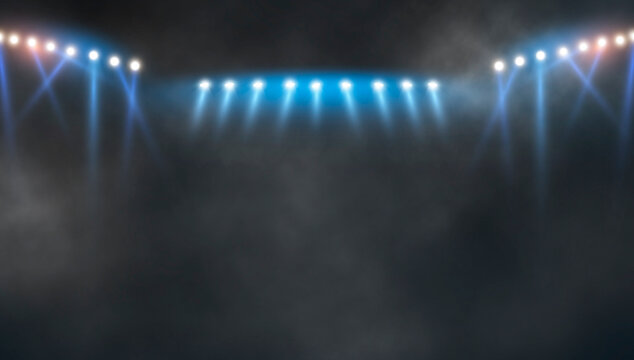 Bright stadium arena lights .stadium lights and smoke against dark night.	
