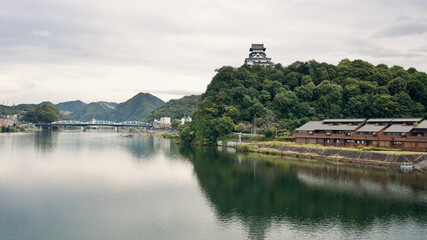 Fototapeta premium Inuyama Castle on hill in a cloud day