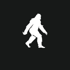 Fototapeta premium White Bigfoot Sasquatch Walking Silhouette on Black Background