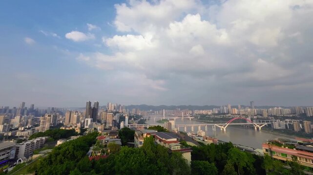 Timelapse cityscape of Chongqing China with dramatic clouds moving rapidly above dense urban skyline. Dynamic megacity atmosphere and architectural growth in southwestern China.