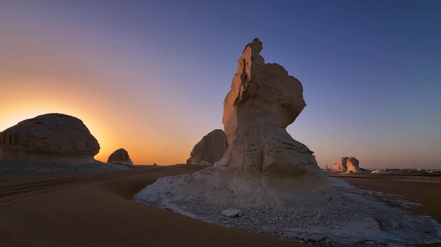 Close view of wind sculpted limestone rock formation in White Desert at sunset