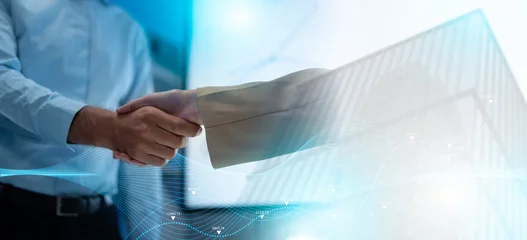 Selbstklebende Fototapeten Altes Krankenhaus Beelitz Close up of a real estate agent and client shaking hands for a successful home insurance deal or property mortgage. Concept of house buying, financial agreement, and investment security at office  © Yingyaipumi