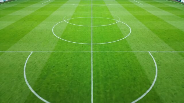 Closeup of freshly mowed soccer field showing center circle and striped grass pattern