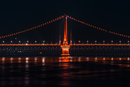 Wuhan Yangtze River Bridge Glowing Over Calm Water