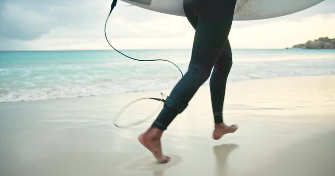 Running, waves and legs of man on beach with surfboard for water sports, adventure and hobby on holiday. Surfer, nature and person ready for surfing activity in ocean on vacation, break and weekend