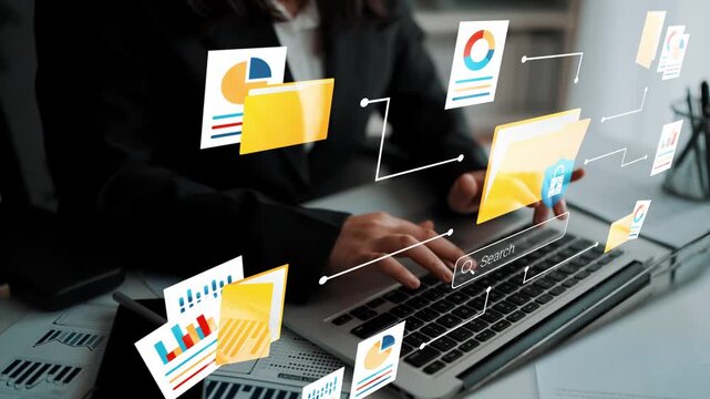 Business professional working on laptop with digital interface displaying graphs, charts, and documents in a modern office setting for data analysis Gluon.