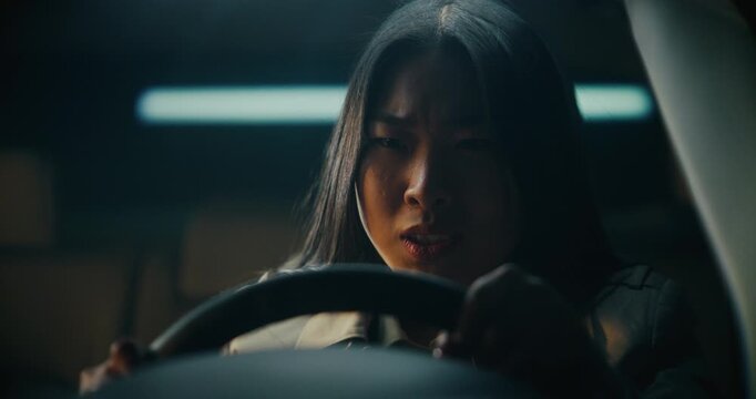 Screams in Frustration, Girl Hits Steering Wheel With Hands, Lowers Head Onto It. Clutching Wheel Tightly, Breathes Deeply, Calm Herself. Stress, Burnout, and Emotional Overload in Modern Urban Life.