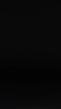 White Table Tennis Ball Moving Across Dark Grid Background