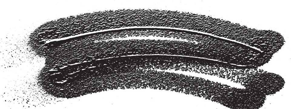 Closeup of a dark textured object with curved lines possibly a sponge or brush.