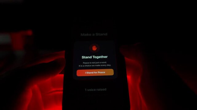 Close-up of a user voting on a mobile app to stop the war. Anxious dramatic atmosphere with flashing red lights