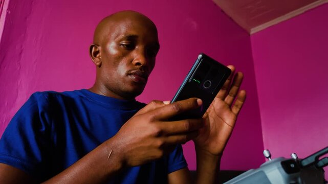 Africa masai man enjoying using his cellphone