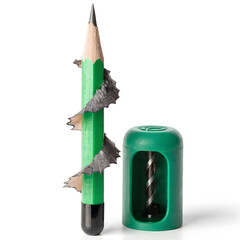 green pencil and sharpener on white background