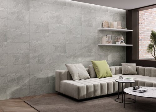 Open living room interior with marble feature wall, large-format floor tiles, plush sofa, and curated decor pieces under warm lighting. Mockup. 3D Rendering. 3D Illustrations