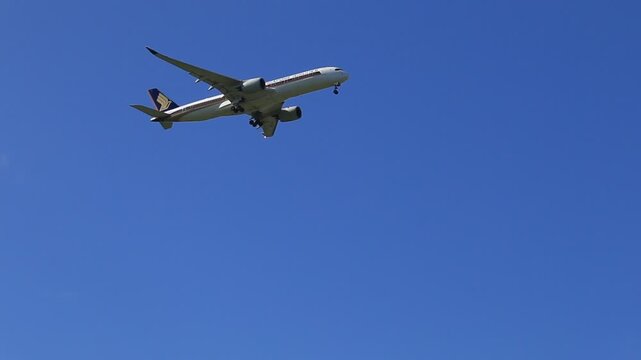 Singapore Airlines aircraft approaching Perth over Swan Valley. The clear blue sky enhances the dramatic aerial view